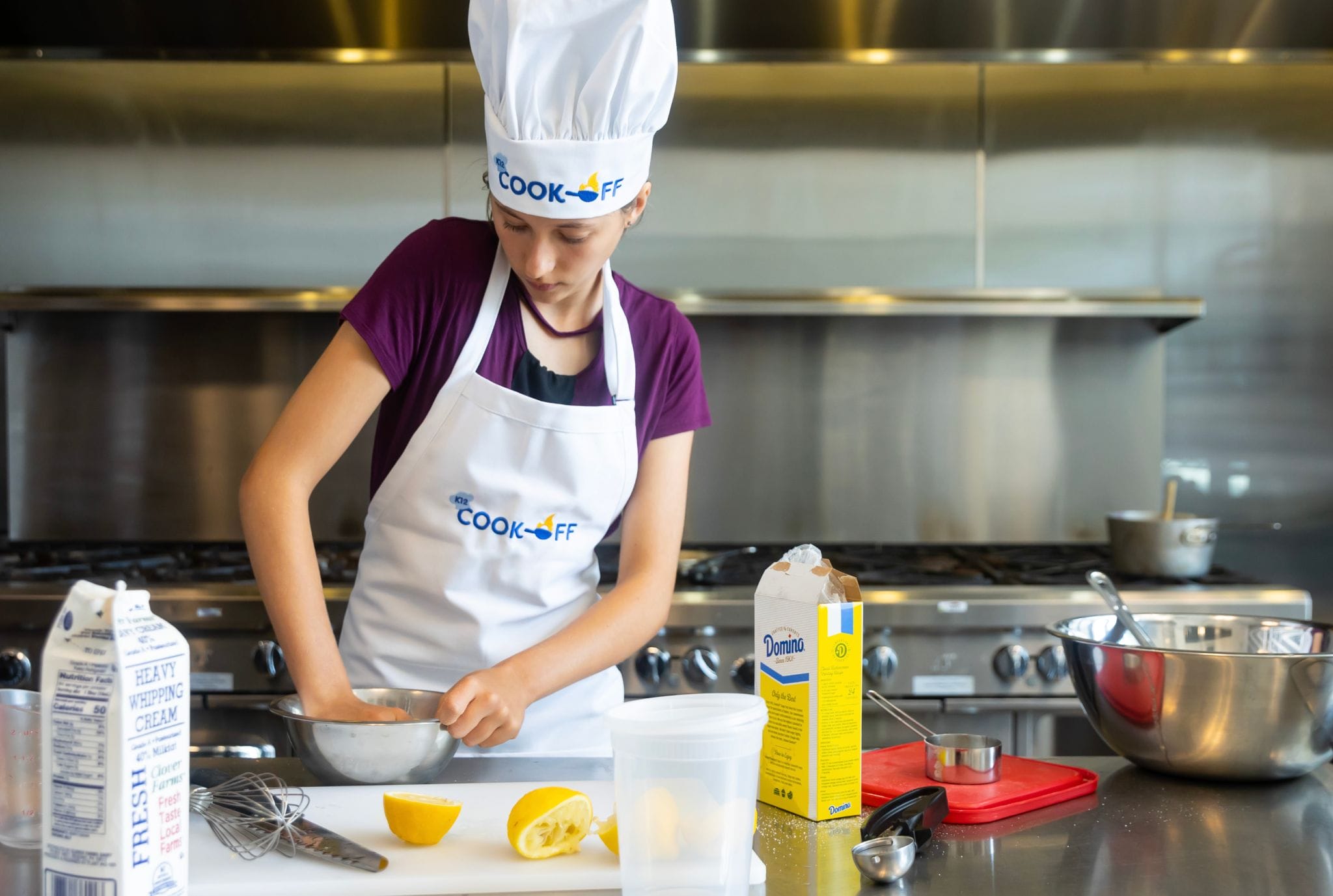 A woman wearing a chef hat skillfully prepares food in a kitchen setting, showcasing her culinary expertise.
