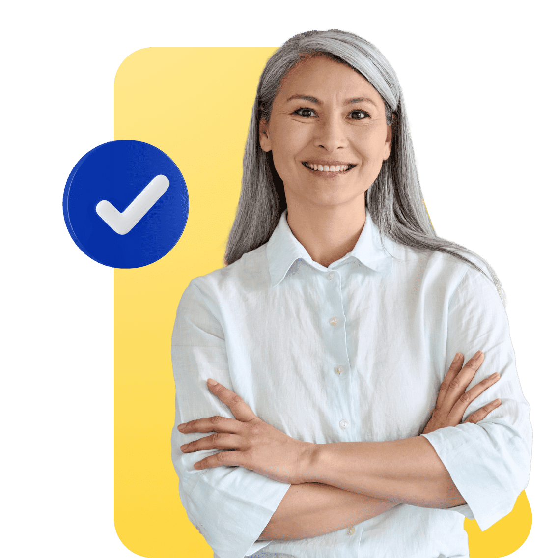 Smiling woman with long gray hair in a light blue shirt stands confidently with arms crossed. A blue check mark is next to her, set against a yellow background.