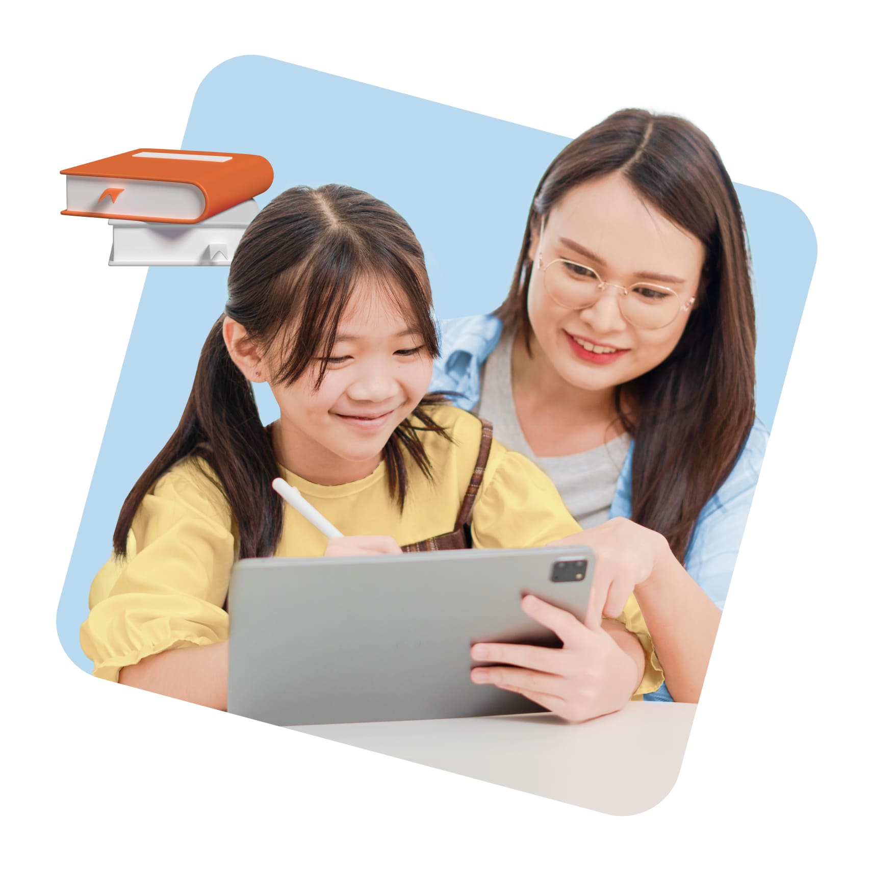A smiling girl in a yellow shirt uses a tablet pen, guided by a woman with glasses. They appear engaged and happy. A stack of books is in the corner.