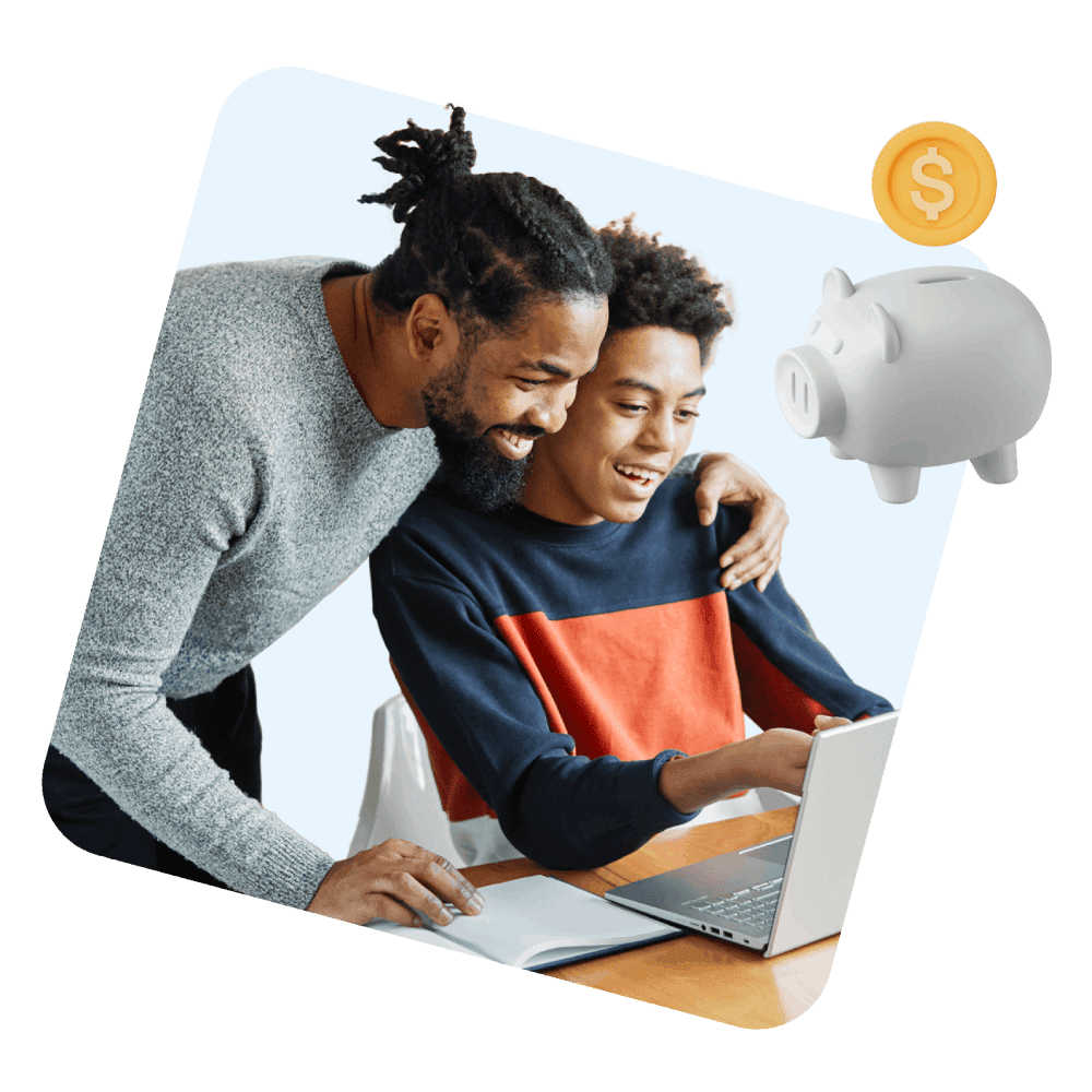 Father and son smiling while using a laptop at a table. A piggy bank and dollar coin icon float nearby, suggesting financial learning.