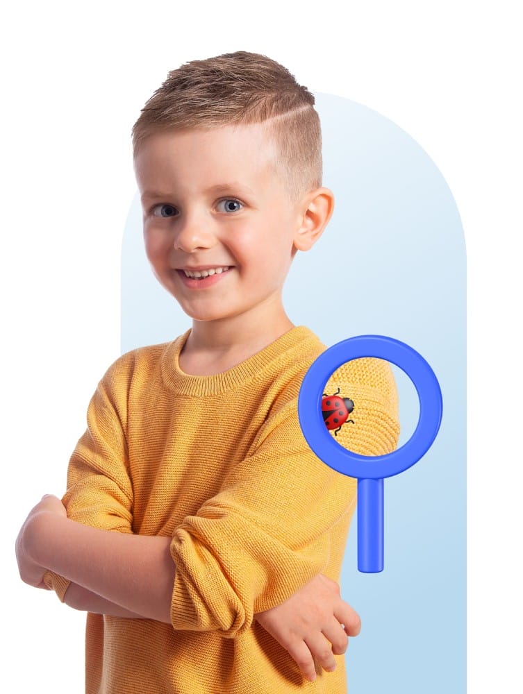 A smiling child in a yellow sweater poses with crossed arms against a light blue background. A blue magnifying glass shows a ladybug on the sweater.